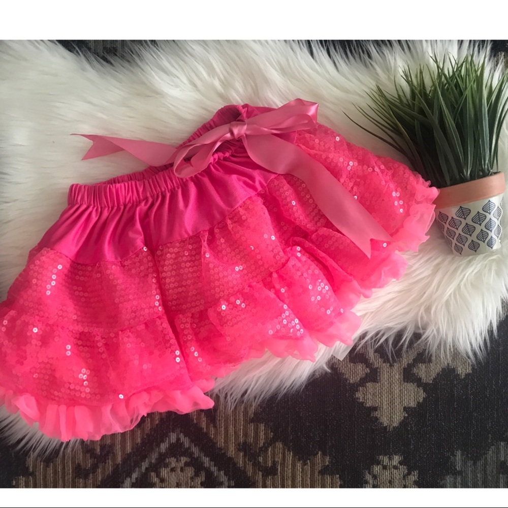 Little girl’s hot pink tutu with ribbon tie